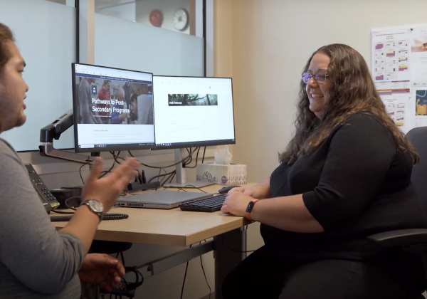 Two people in an office. 